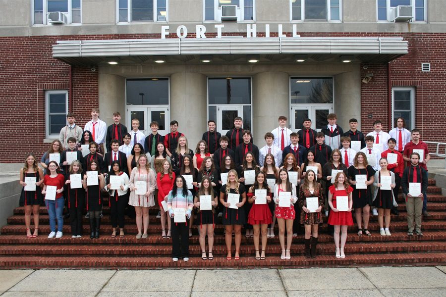 Group of students lined up in front of Fort Hill High School on the steps for a photo.