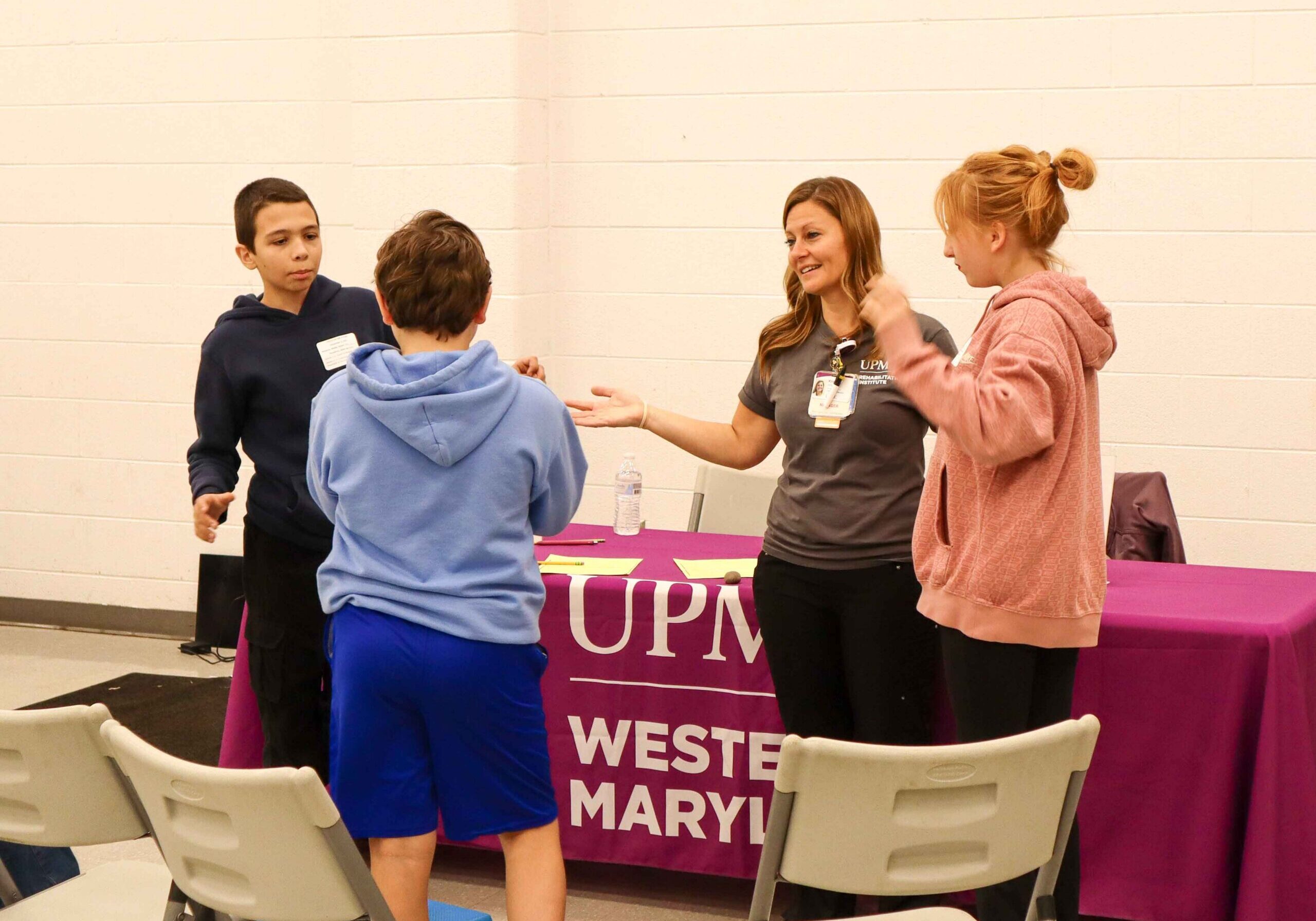 Group of kids and adult participating in an activity.